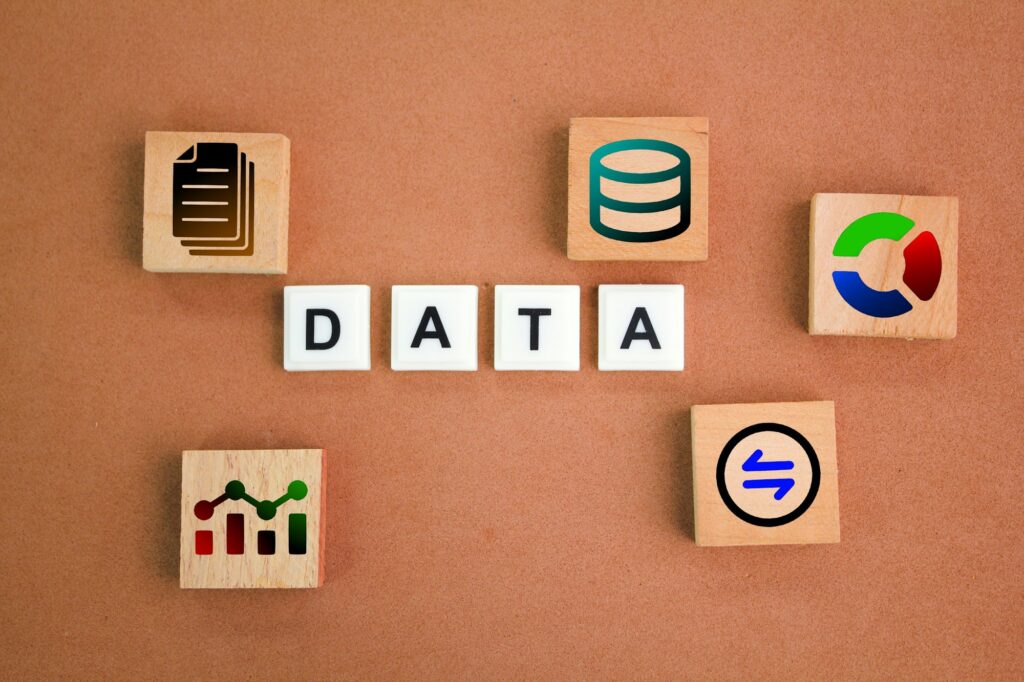 wooden squares and letters of the alphabet with the word data and its icon.